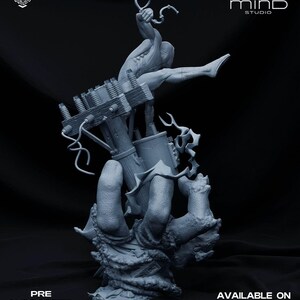 May include: A gray, detailed sculpture of a figure holding a weapon, with a mechanical structure and a textured base. The sculpture has the text "PRE SUPPORTED FILES" and "AVAILABLE ON PATREON".