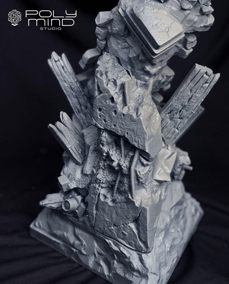 May include: A gray, detailed sculpture of a rocky, fragmented structure with architectural elements. The sculpture features the "POLY MIND STUDIO" logo in the upper left corner. The overall design suggests a post-apocalyptic or fantasy theme.