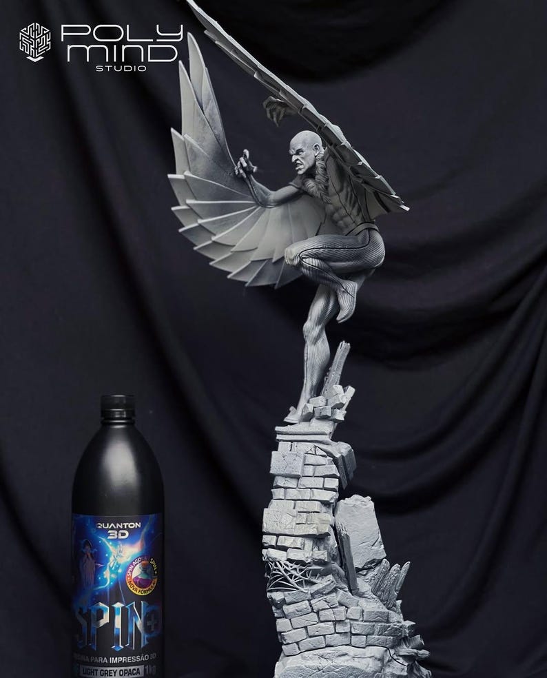 May include: A grayscale sculpture of a winged figure perched atop a crumbling brick structure. The figure has detailed musculature and is in a dynamic pose. A black bottle with blue and white labels is in the foreground. The sculpture is from Poly Mind Studio.