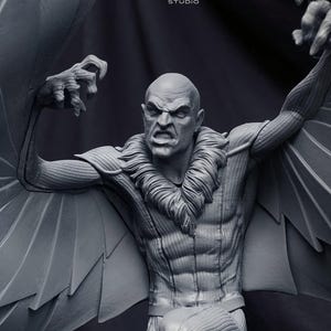 May include: A grayscale sculpture of a bald, muscular figure with large wings, a feathered collar, and an angry expression. The figure's arms are outstretched, and the sculpture is detailed with visible muscles and textures. The Poly Mind Studio logo is in the top left.