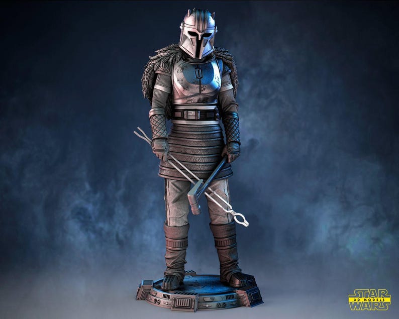 May include: A detailed figurine of a character in silver and gray armor, holding metal tools. The figure stands on a blue platform, with a helmet and fur-like accents. The Star Wars logo is visible in the bottom right corner.