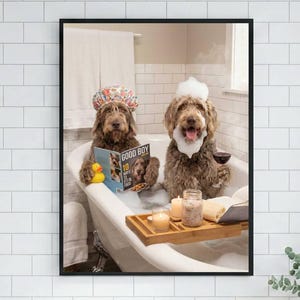 May include: A framed print shows two dogs relaxing in a bathtub filled with bubbles. One dog wears a floral shower cap and reads a magazine titled "Good Boy". The other dog has a bubble beard and holds a glass of wine. A wooden tray holds candles and bath products.
