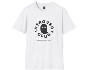 May include: White t-shirt with a black graphic. The graphic features the words "INTROVERT CLUB" in a circle around a ghost illustration. Below the graphic, the text reads "MEMBER SINCE ALWAYS".