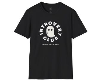 May include: Black t-shirt with a white circular graphic that reads "Introvert Club" with a ghost illustration. Below the graphic, the text reads "Member Since Always".