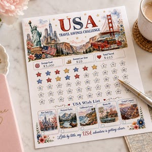 May include: A USA Travel Savings Challenge paper tracker featuring watercolor illustrations of the Statue of Liberty, Golden Gate Bridge, and Route 66. It includes a savings goal of $3,000, a $25 amount per icon, a numbered star grid, and a USA Wish List section.