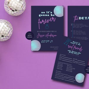 May include: A flat lay featuring wedding invitation suite with disco ball accents. The invitations are dark blue with pink and white text, including the words "so it's gonna be forever" and "the details". Silver disco balls are scattered on a purple background.