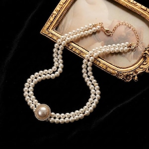 May include: A set of three ceramic mugs with a speckled, matte finish. The mugs are in shades of cream, light gray, and dark gray. Each mug has a simple, minimalist design, perfect for coffee or tea.