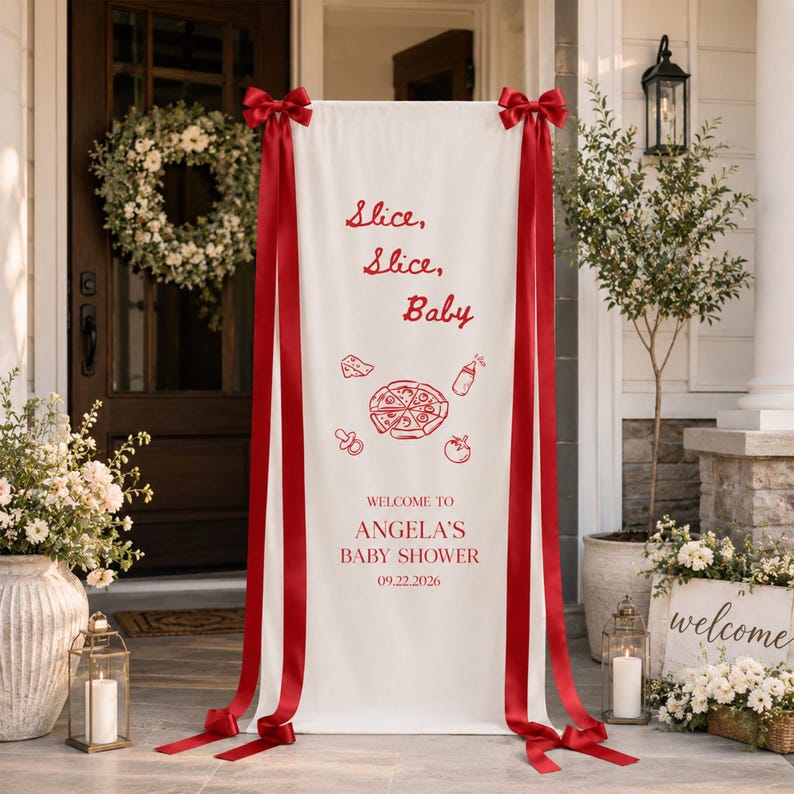 May include: A vertical white fabric banner featuring red text that reads Slice, Slice, Baby, Welcome to Angela's Baby Shower, and 09.22.2026. The banner includes red line art of a pizza, a baby bottle, a pacifier, and a tomato, with red ribbons.