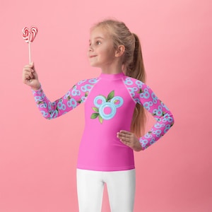 Pool Party Pop Youth Rash Guard – Bright Pink & Blue Float Ring Print – Kids Swimwear for Pool, Beach, and Summer Vacations