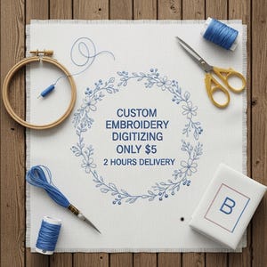 Pode incluir: Um tecido branco com o texto "CUSTOM EMBROIDERY DIGITIZING ONLY $5 2 HOURS DELIVERY" rodeado por uma coroa floral azul. Materiais de bordado: bastidor de madeira, linha azul, tesoura dourada e uma pequena caixa branca com um "B" azul.