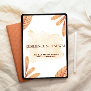 May include: A digital tablet displaying the title "Resilience & Renewal" with the subtitle "A 21-Day Affirmation & Reflection Guide." The tablet is next to a burnt orange notebook and a white stylus. The background is a cream-colored fabric.