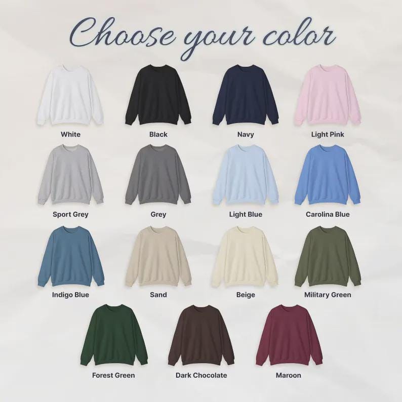 May include: A selection of crewneck sweatshirts in various colors, including white, black, navy, and light pink. The image displays the available colors with labels such as "Sport Grey", "Indigo Blue", and "Maroon". The text "Choose your color" is at the top.