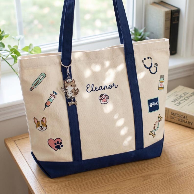 This isn't just a tote; it’s a tribute to the hardworking heroes in the veterinary field. Featuring a stylish navy contrast trim and a collection of meticulously embroidered icons—from a stethoscope to a cute corgi—this personalized Boat Tote is the ultimate blend of professionalism and personality.