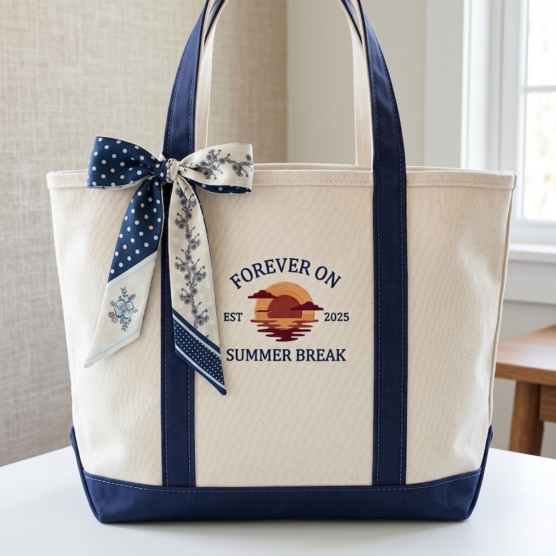 The witty and heartwarming "Forever On Summer Break" design is beautifully machine-embroidered with high-stitch-count vibrant threads, featuring a stunning retro sunset aesthetic. To top it off, a gorgeous, detachable blue-patterned silk-feel ribbon bow is tied to the handle, adding a luxury boutique touch that ordinary totes simply don't have.