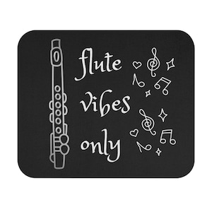 May include: Black square mousepad with a white outline of a flute and the words "flute vibes only." Musical notes, treble clefs, hearts, and stars are scattered around the text.