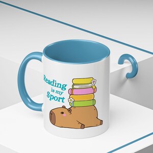 Reading Is My Sport Capybara Stack of Books Mug | Accent Coffee Mug