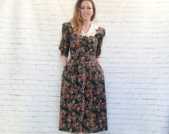 Vestido vintage de los 80 con cuello de encaje paisley, mangas abullonadas y estampado floral, talla M, color verde con bolsillos.