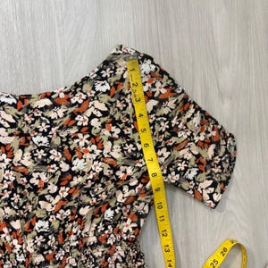 Free People Womens Mini Dress Floral Smocked Waist Flutter Sleeve Black Orange 6 image 15