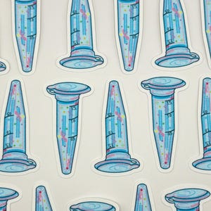 May include: A collection of stickers featuring a blue and pink laboratory microcentrifuge tube design. The tubes have measurement markings and decorative elements. The stickers are arranged on a white background.