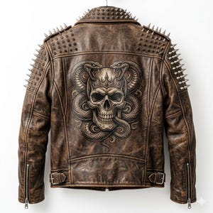 May include: Brown leather jacket with a skull and snake graphic on the back. The jacket features silver spikes on the shoulders and collar, with a zipper closure and buckle details. The jacket is hanging on a hanger.