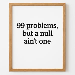 May include: A framed print with the text "99 problems, but a null ain't one" in black font. The print is in a light brown wooden frame, and the background is white.