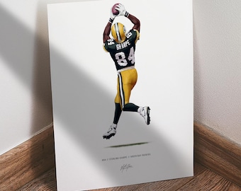 May include: A print featuring a football player in a Green Bay Packers uniform, catching a football. The player is wearing a green and yellow jersey with the number 84 and the name "SHARPE". The print includes the text "#84 // STERLING SHARPE // GREEN BAY PACKERS".
