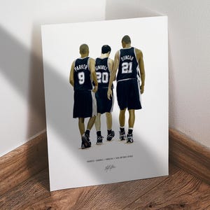 May include: A print featuring three basketball players in black and white uniforms, with the names Parker, Ginobili, and Duncan visible. The players are walking away from the viewer. The print is on white paper.