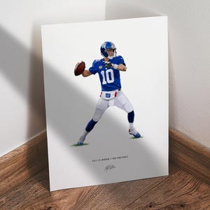 May include: A print featuring a football player in a blue jersey with the number 10, throwing a football. The player is wearing a blue helmet and white pants. The text at the bottom reads "#10 // ELI MANNING // NEW YORK GIANTS" with a signature.
