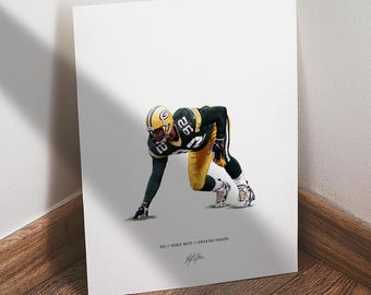 May include: A print featuring a football player in a Green Bay Packers uniform, number 92. The player is in a defensive stance, with a green and gold helmet. The print includes the text "#92 // Reggie White // Green Bay Packers".