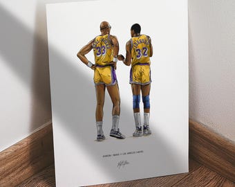 May include: Illustration of two basketball players in yellow and purple uniforms, numbers 33 and 32, from the back. The artwork is on a white background, with the text "KAREEM / MAGIC / LOS ANGELES LAKERS" and a signature at the bottom.