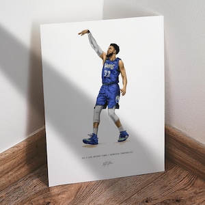 May include: Illustration of a basketball player in a blue uniform, mid-shot. The player is wearing a jersey with the number 32 and the word "Wolves". The image is on a white background, with the player's name and team at the bottom.