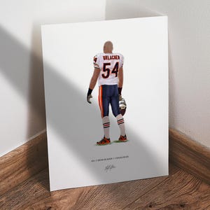 May include: A vertical art print featuring a football player in a white jersey with the name URLACHER and number 54 in navy blue and orange. The player wears navy blue pants with orange stripes, white socks, and holds a helmet. Text reads #54 // BRIAN URLACHER // CHICAGO BEARS.