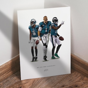 May include: Illustration of three football players in Eagles uniforms. The players are wearing helmets and holding footballs. The text at the bottom reads "SMITH / HURTS / BROWN / PHILADELPHIA EAGLES" and a signature.
