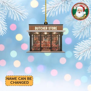 May include: A Christmas ornament shaped like a butcher shop, with the words "BUTCHER STORE" on the awning. The shop's interior is visible through the glass windows, decorated with festive items. A Santa Approved seal is in the upper right corner. The text "NAME CAN BE CHANGED" is at the bottom.