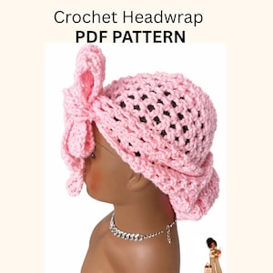 May include: A light pink crochet headwrap featuring a large side bow and an open-weave texture. The text Crochet Headwrap PDF PATTERN is displayed above the headwrap. The item is shown on a mannequin head with a silver chain necklace.