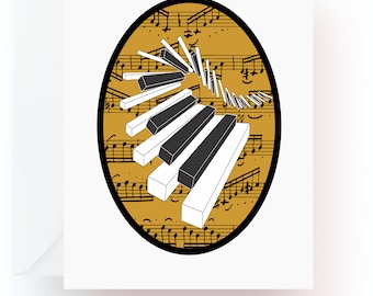 May include: A white greeting card with a black oval design featuring a piano keyboard and musical notes in a gold background. The piano keys are black and white, with a spiral design.
