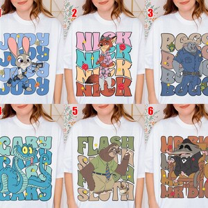May include: White t-shirts featuring cartoon characters from Zootopia. Designs include Judy Hopps, Nick Wilde, Bogo, Gary, Flash, and Mr. Big. Each shirt has the character's name in a stylized font, with colorful accents.