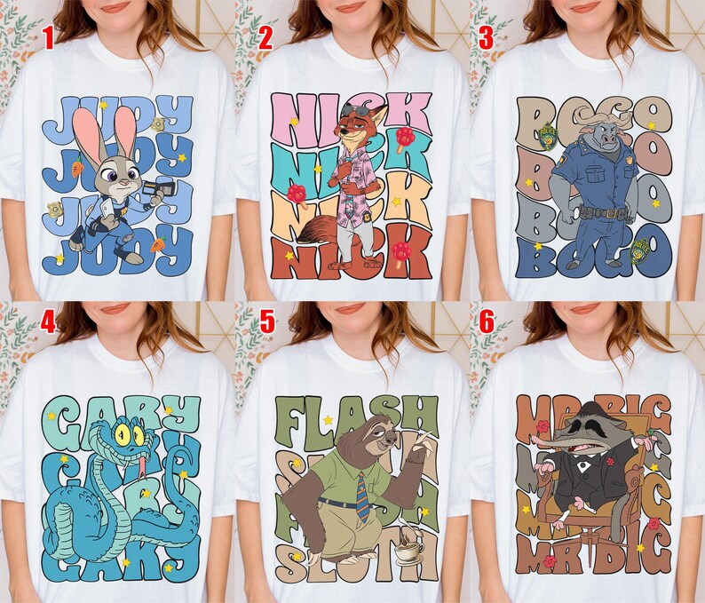 May include: White t-shirts featuring cartoon characters from Zootopia. Designs include Judy Hopps, Nick Wilde, Bogo, Gary, Flash, and Mr. Big. Each shirt has the character's name in a stylized font, with colorful accents.