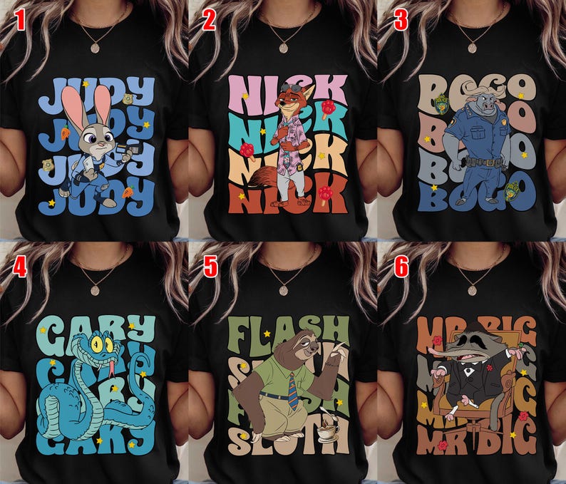 May include: Black t-shirts featuring characters from the animated movie Zootopia. Each shirt displays a different character's name and image: Judy Hopps, Nick Wilde, Chief Bogo, Gary, Flash, and Mr. Big. The designs use various colors and fonts.