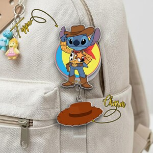 May include: A white ceramic mug with a black handle and the text "But First, Coffee" in a bold, black font. The mug is filled with a dark liquid, likely coffee, and sits on a light-colored surface.