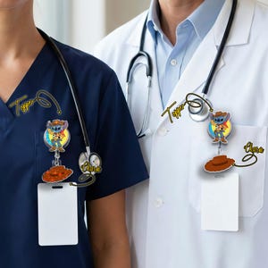 May include: Two medical professionals wearing navy blue and white coats, each with a stethoscope and a retractable badge reel. The badge reels feature a cartoon character in a cowboy outfit and a brown cowboy hat.
