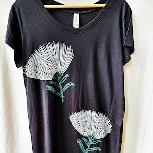Handstamped Ohi&#39;a Lehua blossoms printed on black t-shirt dress.