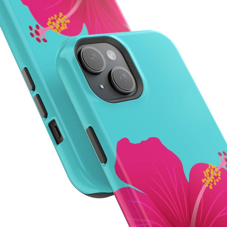 May include: A turquoise phone case featuring a vibrant pink hibiscus flower design. The case has a glossy finish and a black camera module. The floral pattern is visible on the front and back of the case, creating a tropical aesthetic.