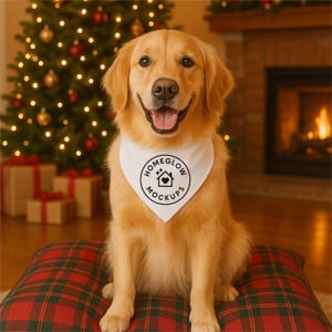May include: A golden retriever wearing a white bandana with the text "HOMEGLOW MOCKUPS" in a black circle. The dog sits on a red and green plaid pillow in front of a Christmas tree and fireplace.