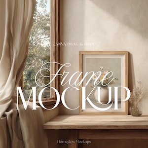 May include: A wooden framed art print mockup featuring a floral still life in a vase. The frame sits on a wooden table next to a small glass vase with dried flowers. The words "Frame MOCKUP" are displayed in white script.