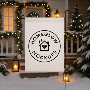 May include: A white garden flag with a black circular logo that reads "HOMEGLOW MOCKUPS" around a house icon with a heart. The flag is displayed outdoors in a snowy scene with Christmas lights and lanterns.