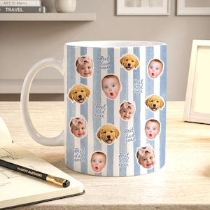 May include: A white ceramic mug featuring a light blue vertical striped pattern. The mug is decorated with repeating circular photo cutouts of a baby and a golden retriever puppy, interspersed with the handwritten blue text Best dad ever.