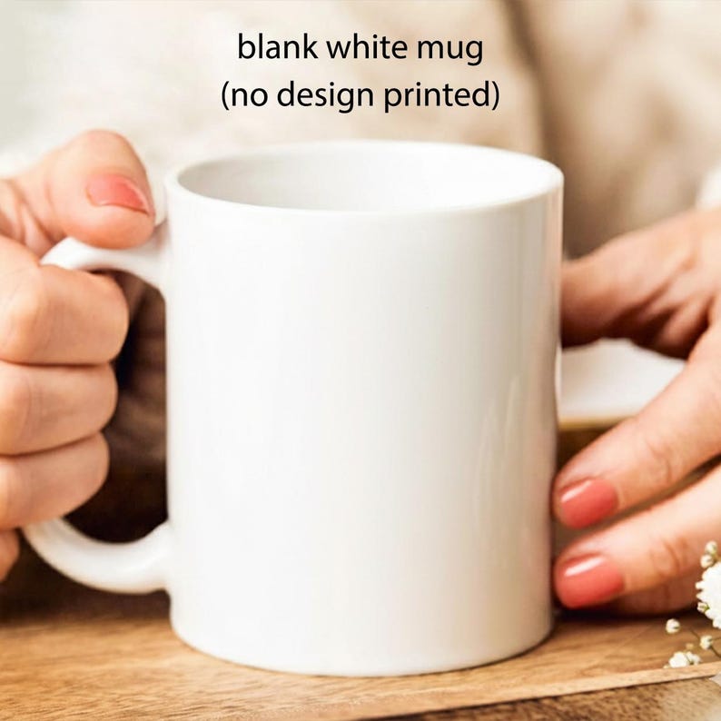 May include: A plain white ceramic mug with a smooth finish and a curved handle. The mug is completely blank with no design printed on its surface. The text above the mug reads: blank white mug (no design printed).