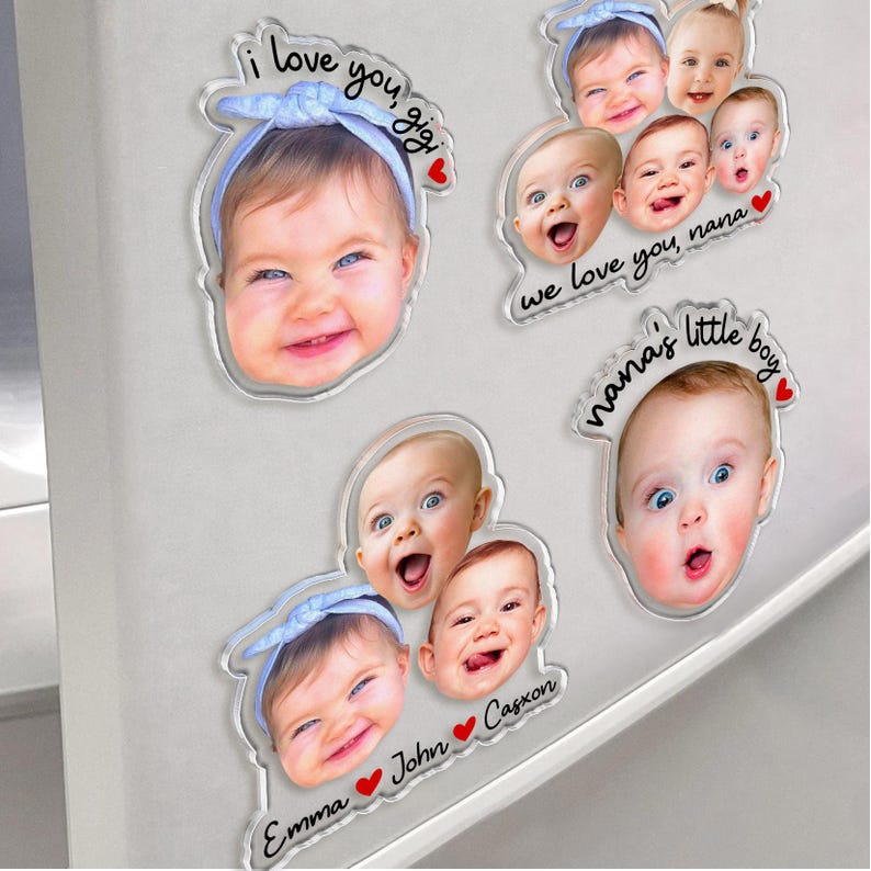 May include: Four custom acrylic magnets featuring high-resolution baby portraits. One magnet displays a baby with a blue headband and text "i love you, gigi". Another shows three babies with "we love you, nana". Others feature "nana's little boy" and "Emma John Caxon".