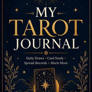 May include: A dark blue journal cover with gold foil accents featuring the text MY TAROT JOURNAL, Daily Draws, Card Study, Spread Records + Much More, and APW PUBLISHING. The design includes a central tarot card illustration, stars, and vines.
